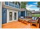 Comfortable outdoor seating on the wooden deck with a cozy lounge area and direct access to the home through french doors at 1136 Moreland Se Pl, Atlanta, GA 30316