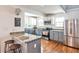 Kitchen with stainless steel appliances, granite countertops, and two-tone cabinets offers a sleek design at 1136 Moreland Se Pl, Atlanta, GA 30316