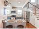 Stylish kitchen with stainless steel refrigerator, breakfast bar, and granite countertops at 1136 Moreland Se Pl, Atlanta, GA 30316