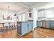 Eat-in kitchen featuring stainless appliances, two-tone cabinets, granite counters, and open to the dining room at 1136 Moreland Se Pl, Atlanta, GA 30316
