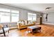 Cozy living room with hardwood floors, neutral decor, and an inviting, comfortable space at 1136 Moreland Se Pl, Atlanta, GA 30316
