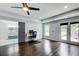 Spacious bedroom has hardwood floors, an adjacent bathroom, and access to a deck through double doors at 1740 Dodson Sw Dr, Atlanta, GA 30311
