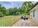 Outdoor deck with seating area and view of the lush backyard and greenery; perfect for relaxing or entertaining at 1740 Dodson Sw Dr, Atlanta, GA 30311