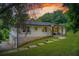 Charming home with stone foundation, walkway to front porch, and professionally landscaped front yard at 1740 Dodson Sw Dr, Atlanta, GA 30311
