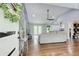 Open-concept living area with hardwood floors, vaulted ceilings, seamlessly connecting to the kitchen and dining spaces at 1740 Dodson Sw Dr, Atlanta, GA 30311