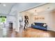 Charming sitting area with hardwood floors and a view into the open-concept living and kitchen spaces at 1740 Dodson Sw Dr, Atlanta, GA 30311