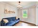 Cozy sitting area with hardwood floors, a stylish chandelier, perfect for relaxation or casual gatherings at 1740 Dodson Sw Dr, Atlanta, GA 30311