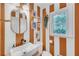 Stylish bathroom featuring a floating sink, designer mirror and trendy accents at 201 Tweed Ct, Sugar Hill, GA 30518