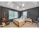 Cozy bedroom with neutral decor and a window for natural light at 201 Tweed Ct, Sugar Hill, GA 30518