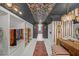 Spacious walk-in closet with custom shelving, cabinets, and seating at 201 Tweed Ct, Sugar Hill, GA 30518