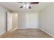 Comfortable bedroom with carpeted floors, closet, and a ceiling fan at 9119 Woodgreen Way, Jonesboro, GA 30238