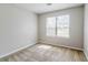 Cozy bedroom with natural light streaming through the window and plush carpeting at 9119 Woodgreen Way, Jonesboro, GA 30238