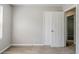 Bedroom with a closet, neutral walls, carpeted flooring, and a window overlooking the outdoors at 9119 Woodgreen Way, Jonesboro, GA 30238