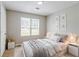 Bright bedroom with a comfortable bed, neutral decor, and ample natural light at 9119 Woodgreen Way, Jonesboro, GA 30238
