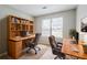 Functional home office with two desks and built-in shelving, perfect for remote work at 9119 Woodgreen Way, Jonesboro, GA 30238