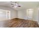 Bright living room with wood floors leading to dining area, with fireplace at 9119 Woodgreen Way, Jonesboro, GA 30238