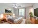 Serene main bedroom with natural light, a comfortable bed, and modern furnishings at 9119 Woodgreen Way, Jonesboro, GA 30238