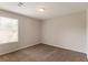 Bright bedroom featuring neutral walls, plush carpeting, and a window with blinds at 9542 Canvasback Ct, Jonesboro, GA 30238