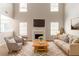 Spacious living room with high ceilings, a fireplace, and ample natural light at 9542 Canvasback Ct, Jonesboro, GA 30238
