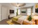 Serene main bedroom with a tray ceiling, modern decor, and plenty of natural light at 9542 Canvasback Ct, Jonesboro, GA 30238