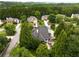 Aerial view of a backyard patio nestled among mature trees, creating a private outdoor space at 1023 Spruce Creek Ln, Lawrenceville, GA 30045
