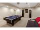 Finished basement featuring a pool table and a comfortable seating area at 1023 Spruce Creek Ln, Lawrenceville, GA 30045