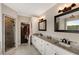 Spacious bathroom with double vanity, granite countertop, and walk-in shower at 1023 Spruce Creek Ln, Lawrenceville, GA 30045