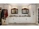 Bathroom with double sinks, granite countertops, and a large mirror at 1023 Spruce Creek Ln, Lawrenceville, GA 30045