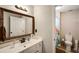 Bathroom with white vanity and framed mirror, plus colorful shower curtain at 1023 Spruce Creek Ln, Lawrenceville, GA 30045