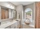 Bright bathroom with single vanity and a decorative window seat at 1023 Spruce Creek Ln, Lawrenceville, GA 30045