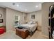 Cozy bedroom with neutral colors, a bright window, and comfortable furnishings at 1023 Spruce Creek Ln, Lawrenceville, GA 30045