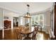 Well-lit dining room featuring a classic wooden table and window views at 1023 Spruce Creek Ln, Lawrenceville, GA 30045