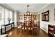 Cozy dining room with traditional wooden furniture and decorative artwork at 1023 Spruce Creek Ln, Lawrenceville, GA 30045