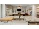 Close-up of a kitchen island featuring granite countertops, stainless steel sink, and white cabinets at 1023 Spruce Creek Ln, Lawrenceville, GA 30045