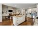 Modern kitchen featuring white cabinets, granite countertops, a large island, and stainless steel appliances at 1023 Spruce Creek Ln, Lawrenceville, GA 30045
