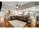 Spacious living room with hardwood floors, a ceiling fan, and an open layout at 1023 Spruce Creek Ln, Lawrenceville, GA 30045