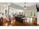 Bright living room with hardwood floors, a comfortable seating area, and access to outdoor spaces at 1023 Spruce Creek Ln, Lawrenceville, GA 30045
