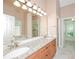 Bathroom featuring double sinks, granite countertops, and updated fixtures at 1305 Kelly Nelson Dr, Lawrenceville, GA 30043