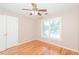 Bedroom featuring gleaming hardwood floors and natural light at 1305 Kelly Nelson Dr, Lawrenceville, GA 30043