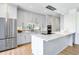 Modern kitchen with stainless steel appliances, marble countertops, and light wood flooring at 2575 Peachtree Ne Rd # 6G, Atlanta, GA 30305