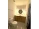Well-lit bathroom features bright lights, a toilet, a sink, and a vanity with modern fixtures at 320 Martin Luther King Jr Dr # 5, Atlanta, GA 30312