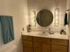 Bathroom features vanity with storage, sink, and framed mirror that provide a comfortable and functional space at 320 Martin Luther King Jr Dr # 5, Atlanta, GA 30312