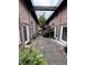 Outdoor courtyard featuring brick walls, multiple entry doors, and lush landscaping at 320 Martin Luther King Jr Dr # 5, Atlanta, GA 30312
