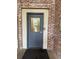 Exterior door of the building with a small clear window to the interior at 320 Martin Luther King Jr Dr # 5, Atlanta, GA 30312