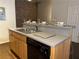 Open-concept kitchen showcasing stainless steel sink, modern appliances, and breakfast bar for meal preparation and dining at 320 Martin Luther King Jr Dr # 5, Atlanta, GA 30312