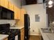 A well-equipped kitchen featuring stainless steel appliances, wood cabinets, and efficient layout for a modern cooking experience at 320 Martin Luther King Jr Dr # 5, Atlanta, GA 30312