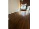 Bright living room with hardwood floors, large windows with blinds, and white walls, creating a welcoming space at 320 Martin Luther King Jr Dr # 5, Atlanta, GA 30312