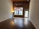 Spacious living room with hardwood floors and exposed brick wall offering a blend of modern comfort and industrial charm at 320 Martin Luther King Jr Dr # 5, Atlanta, GA 30312