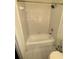 Bright, tiled shower and bathtub features a shower head and neutral tiling at 320 Martin Luther King Jr Dr # 5, Atlanta, GA 30312