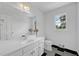 Well-lit bathroom with a large mirror, vanity, and checkered flooring at 3243 Northbrook Dr, Atlanta, GA 30341